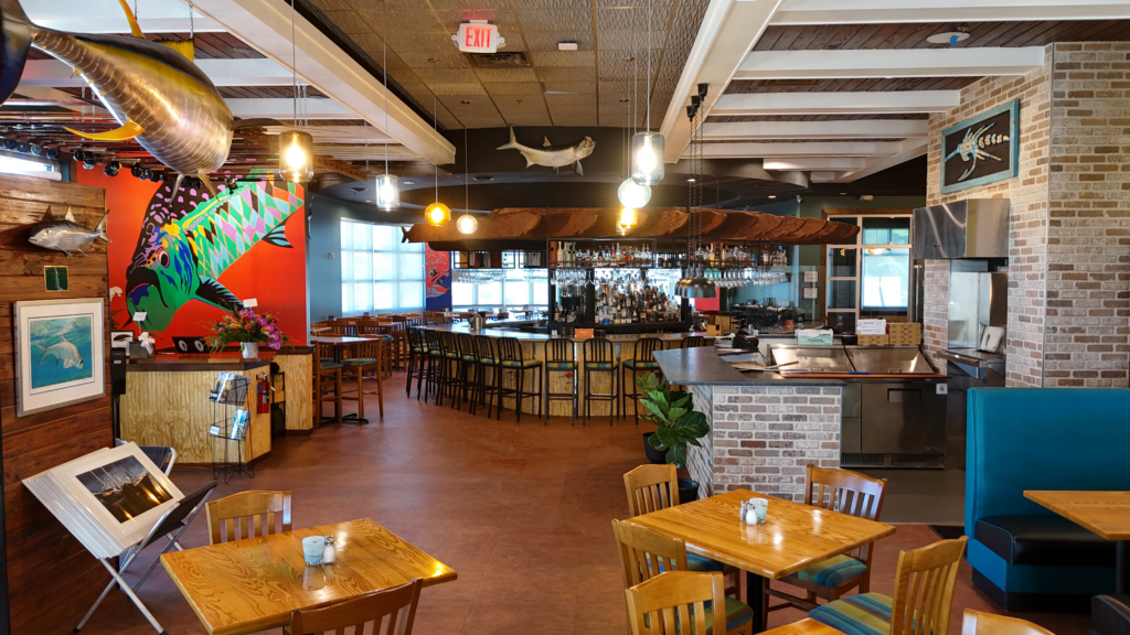 Restaurant dining room with colorful walls and wooden tables